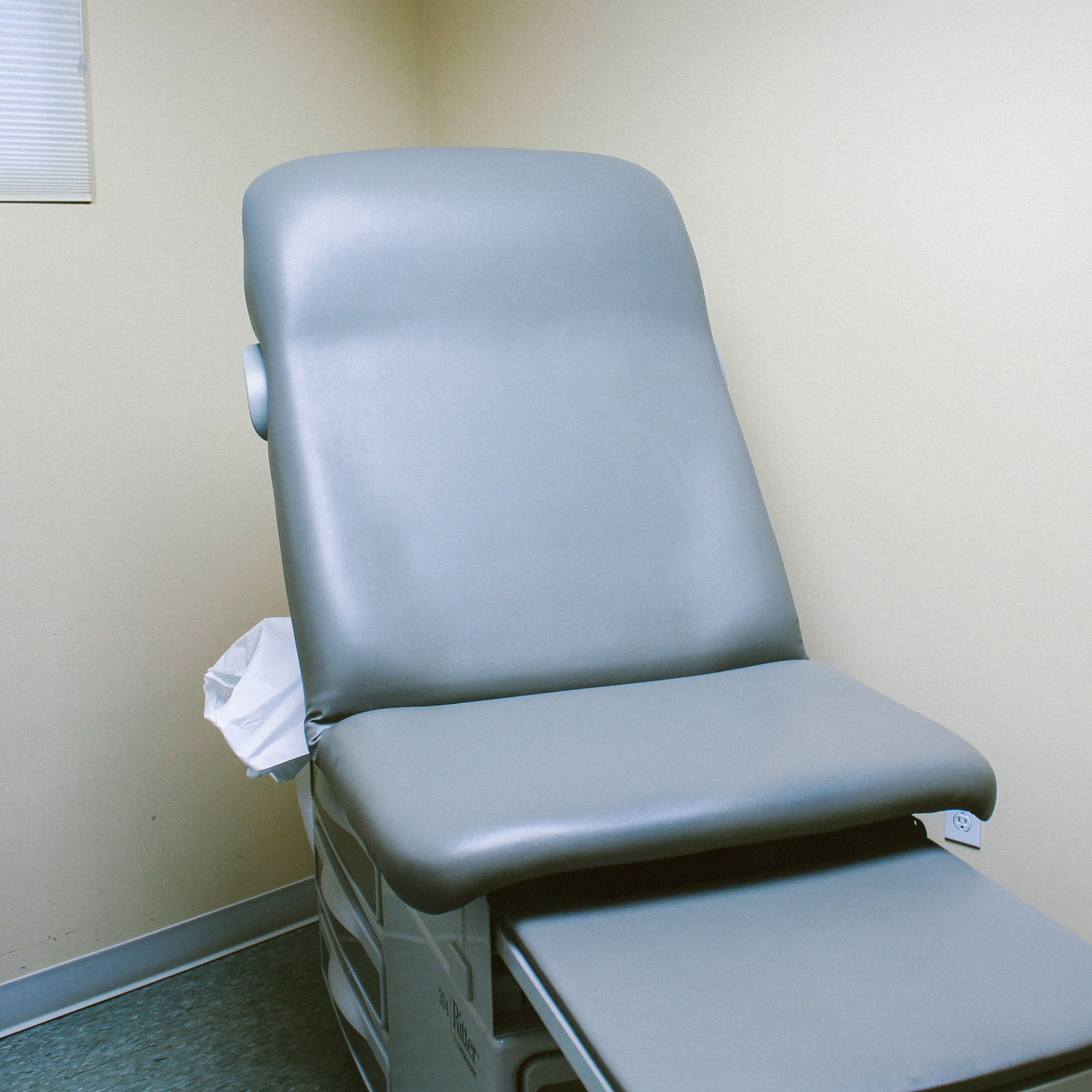 A photo of a patient's chair in the doctor's room.