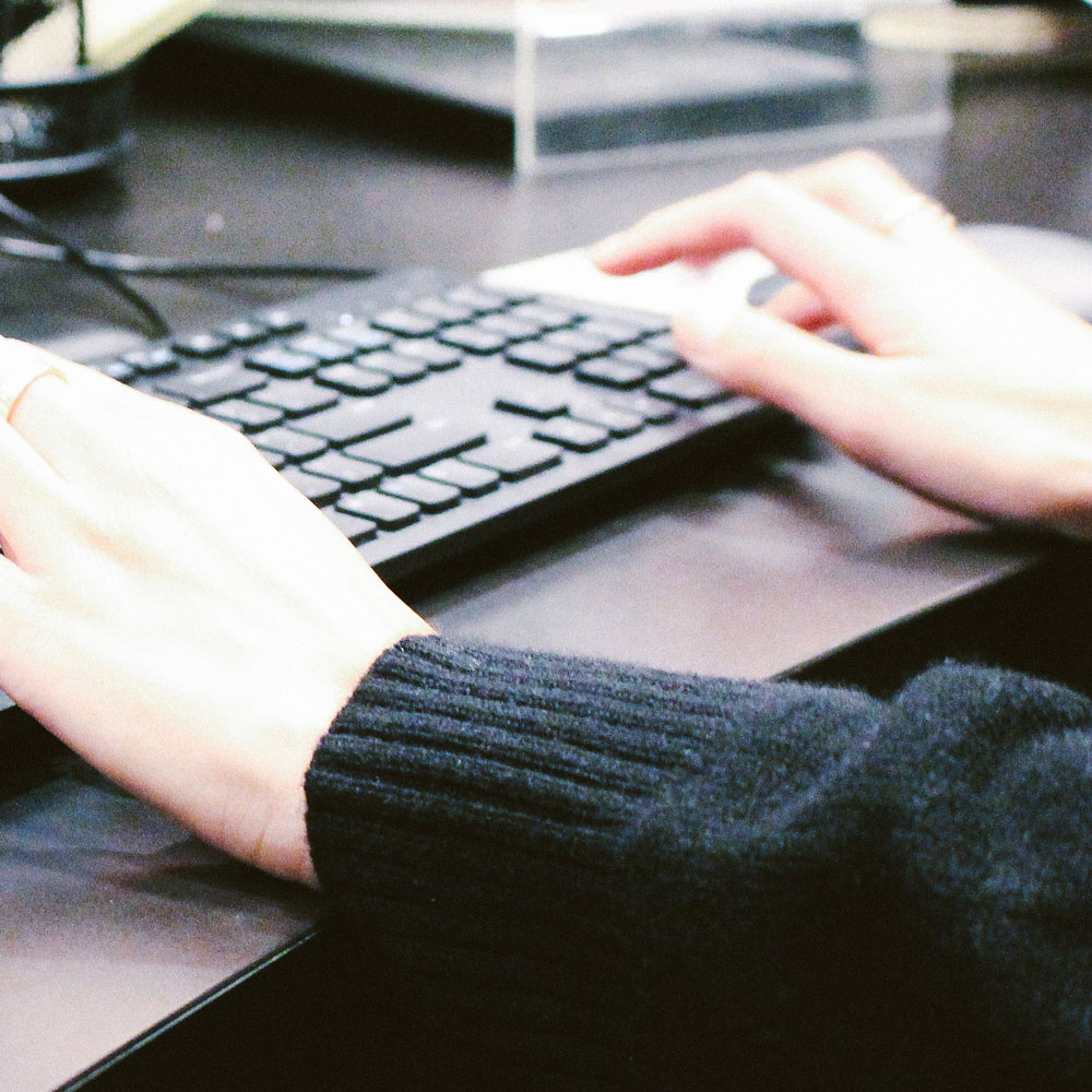 An image of someone typing on a computer keyboard.