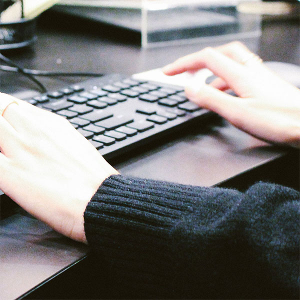 Receptionist of Plastic Surgery Arts Of West Michigan working in computer